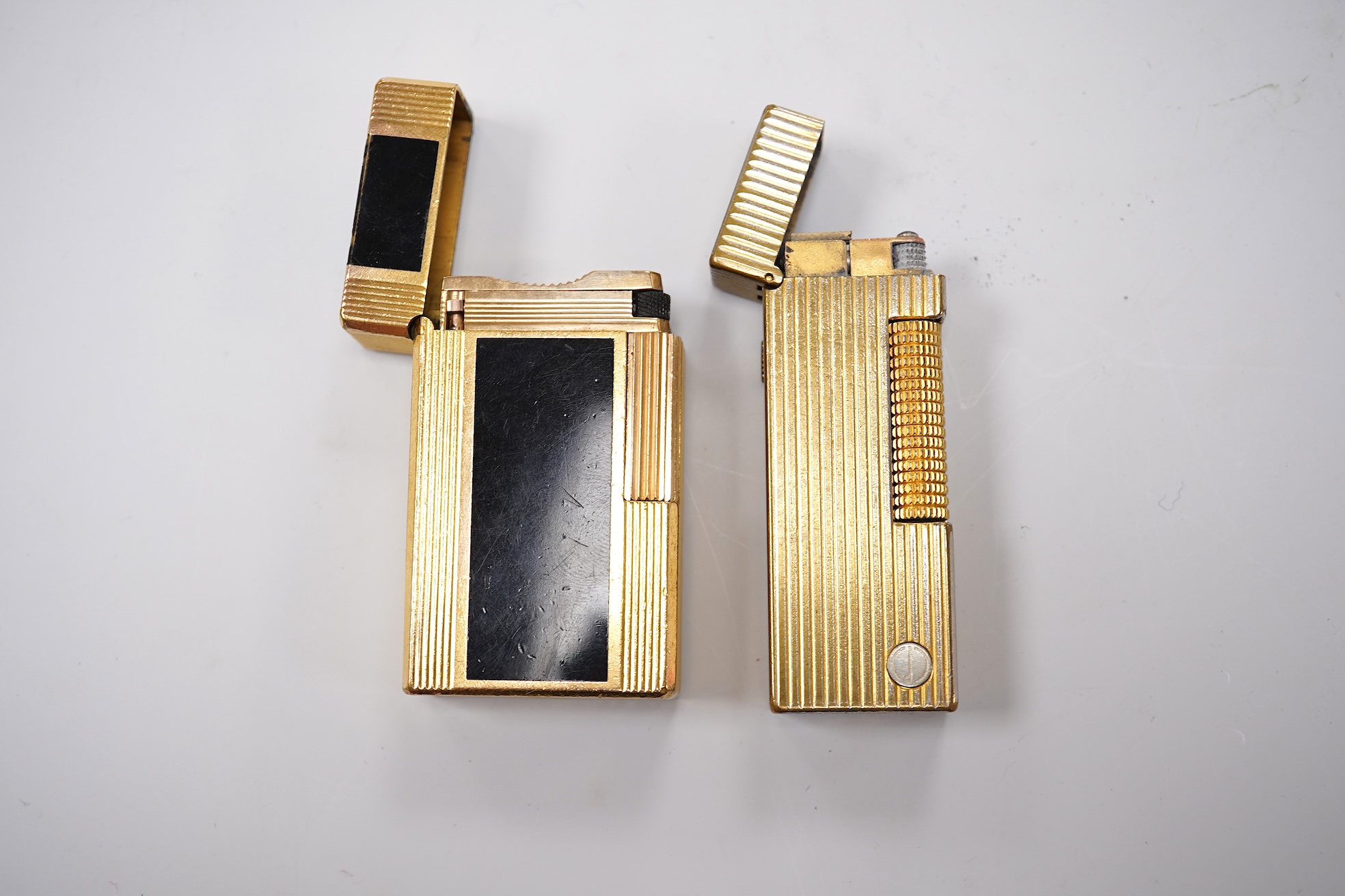 Sundry items comprising two Dupont and Dunhill lighters and cased gold and a set of cased pearl dress studs